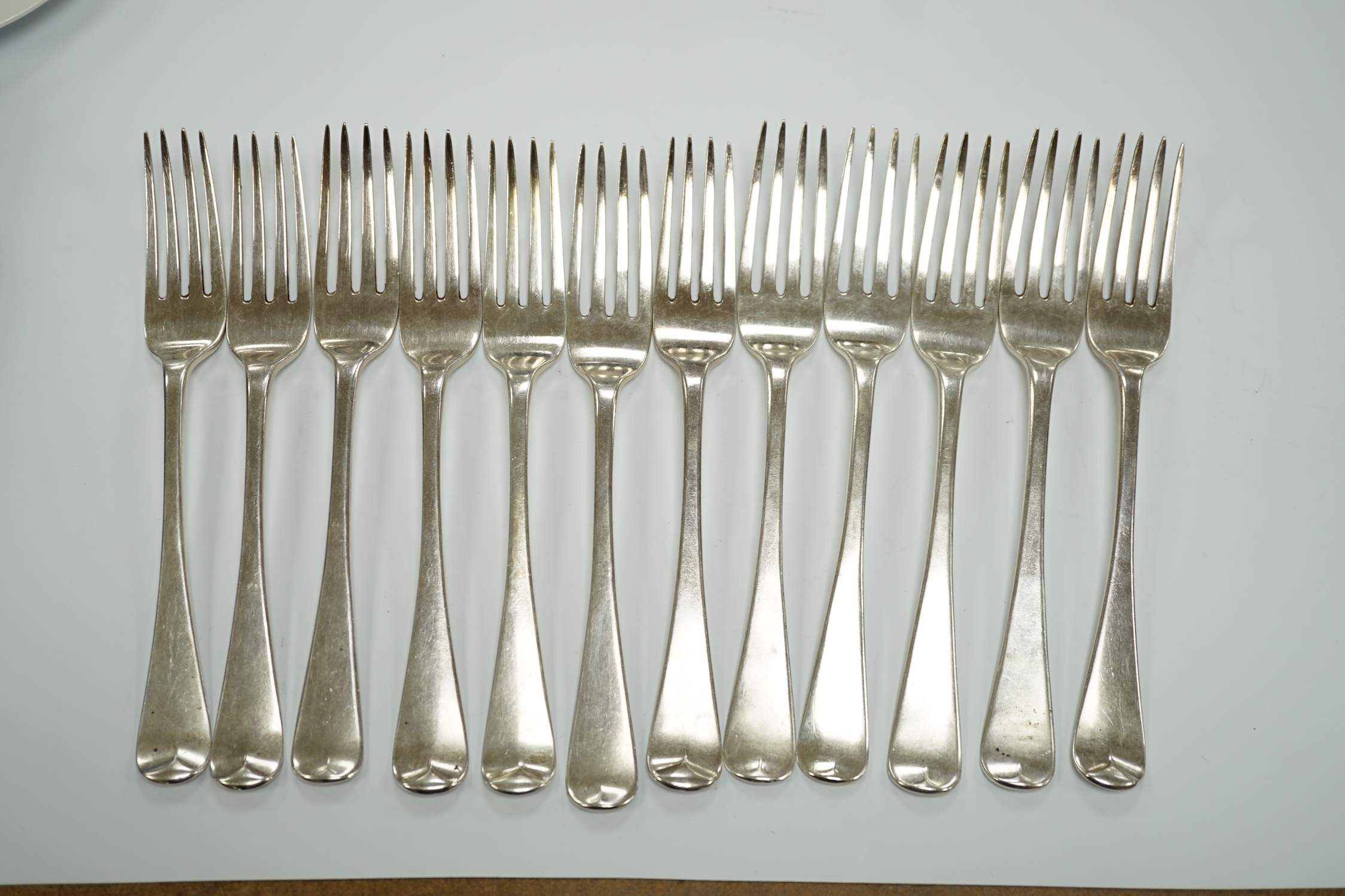 A set of six George IV silver table forks, London, 1824 and a later similar Victorian set, London, 1837, 25.8oz.